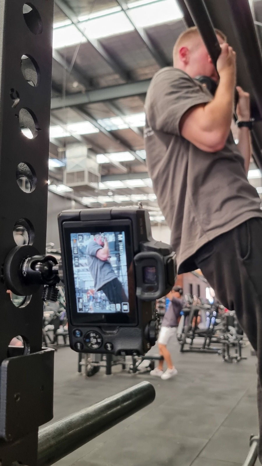 Phone attached to gym equipment using the Pocket Mount